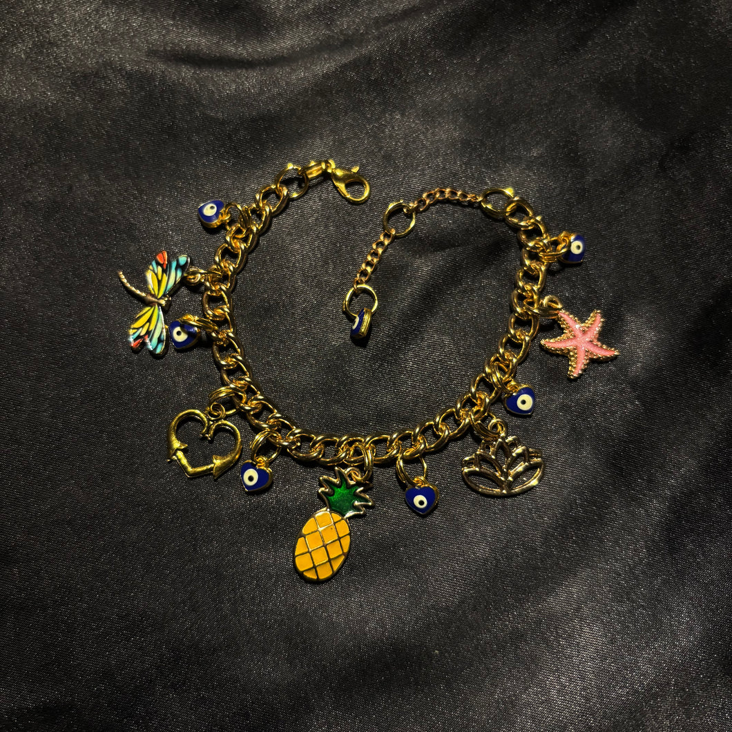 gold enamel charm bracelet.