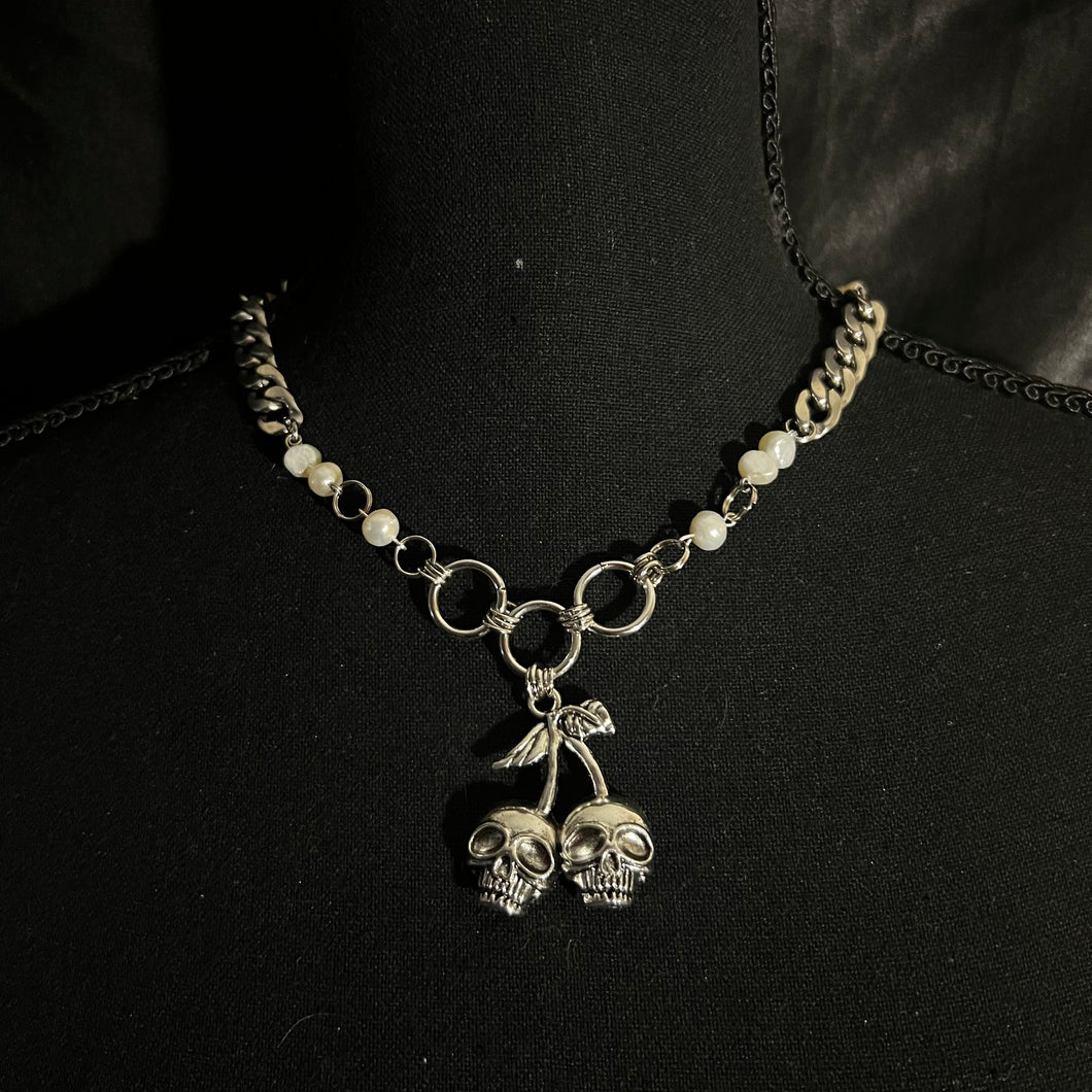 thick skull necklace.