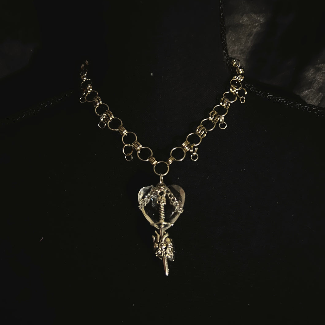 crystal heart sword necklace.