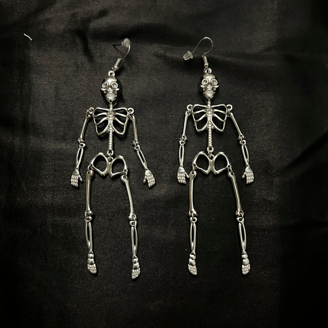 skeleton earrings.